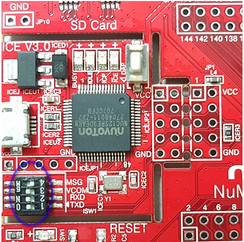 Red development board with Nuvoton microcontroller, SD card slot, and ISW1 switch labeled MSG.